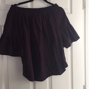 woman’s flannel off the shoulder shirt